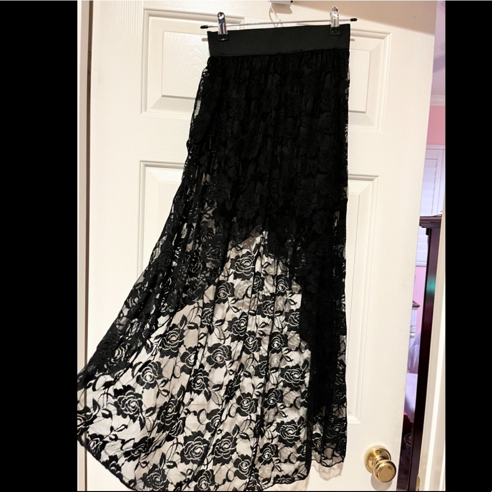 Black lace skirt shirt in front but long in back maxi.